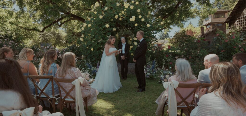 wedding ceremony at Starling Lane Vineyard in the rose garden
